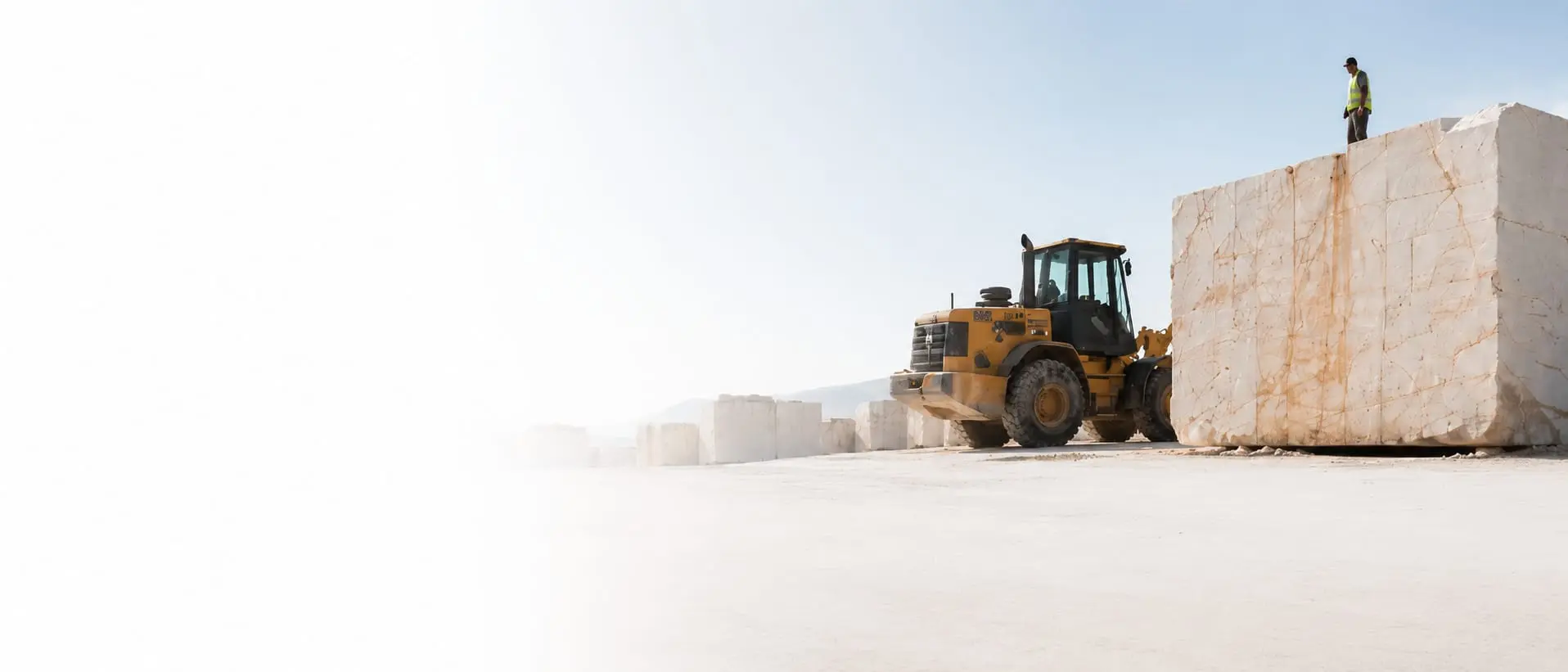 A loader lifting product at the source